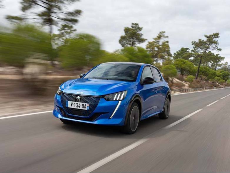 Peugeot e-208 driving on road