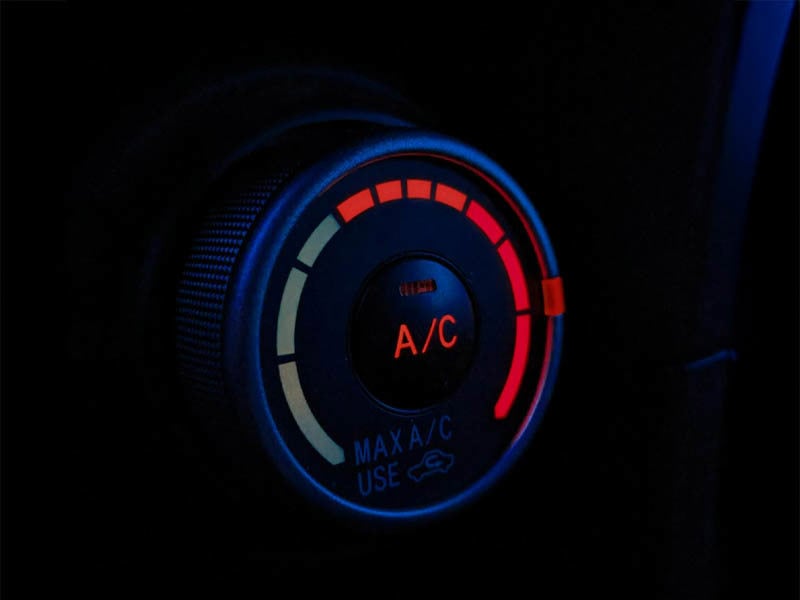 Air conditioning dial with red lights on