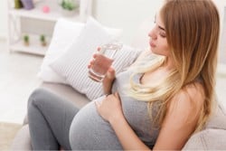 Pregnant woman drinking water