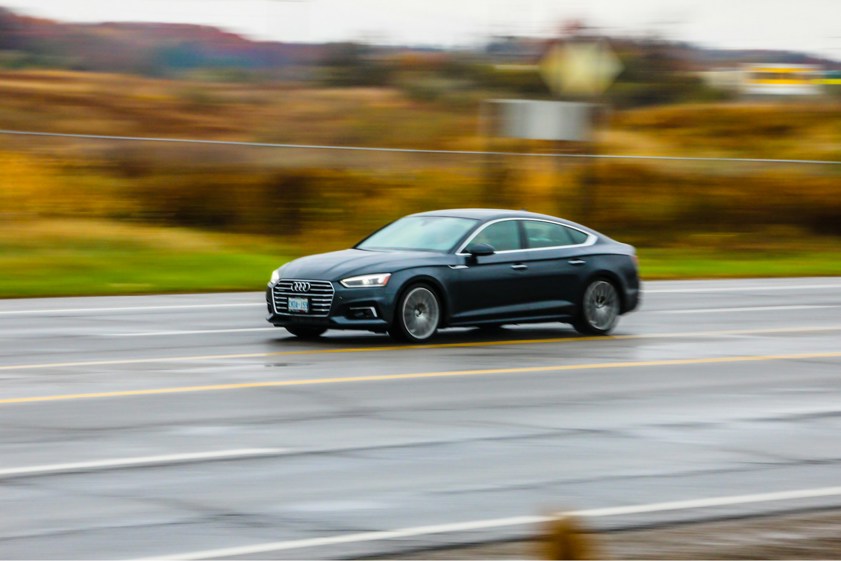 Black Audi driving on a motorway