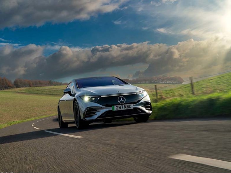 Mercedes EQS on a country road on a bright day