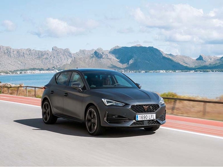 Black Seat Leon Hatchback on a coastal road