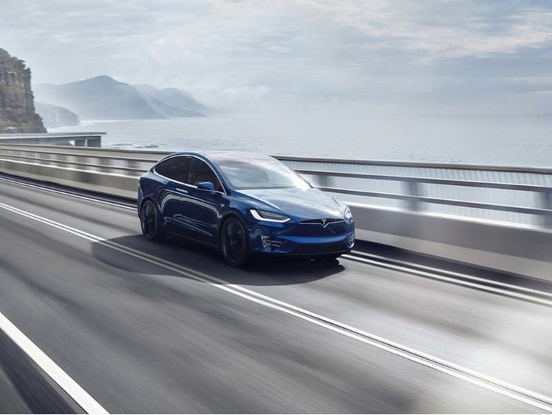 Tesla Model X on a coastal road