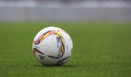 white and gray adidas soccerball on lawn grass