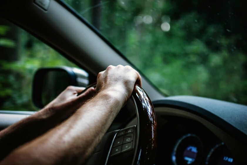 Two hands on the steering wheel