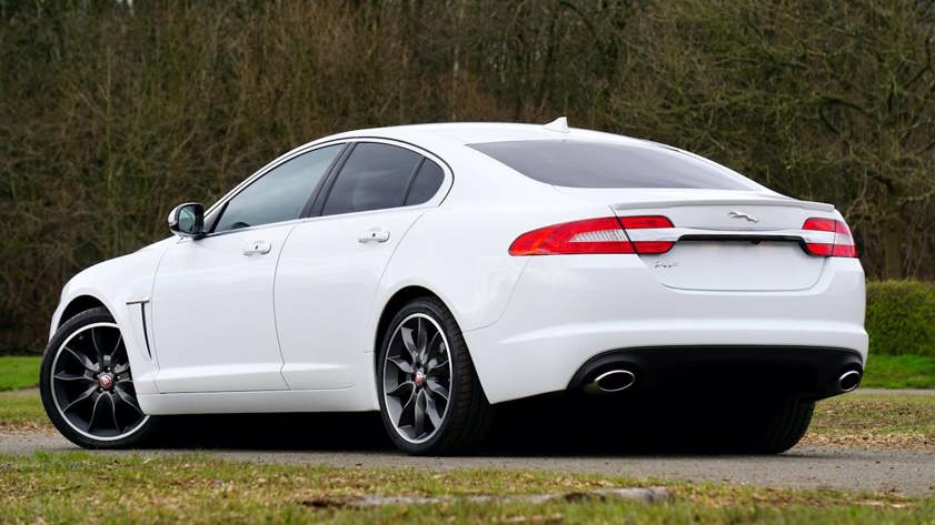 White Jaguar saloon car rear end