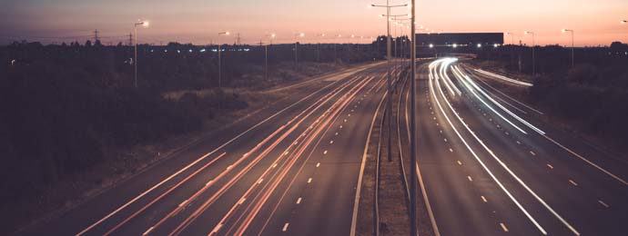cars driving on motorway at dusk