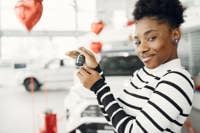 Young woman holding car keys