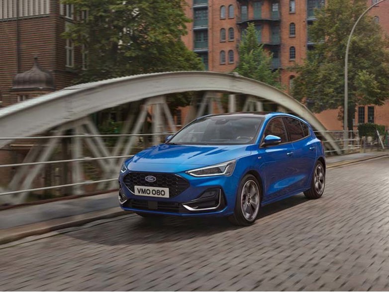 Ford Focus crossing a city bridge