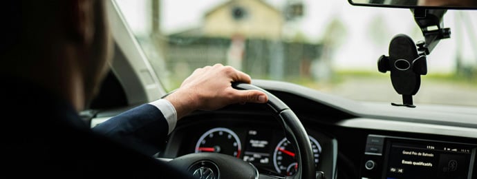 Businessman Driving Car on Rainy Day